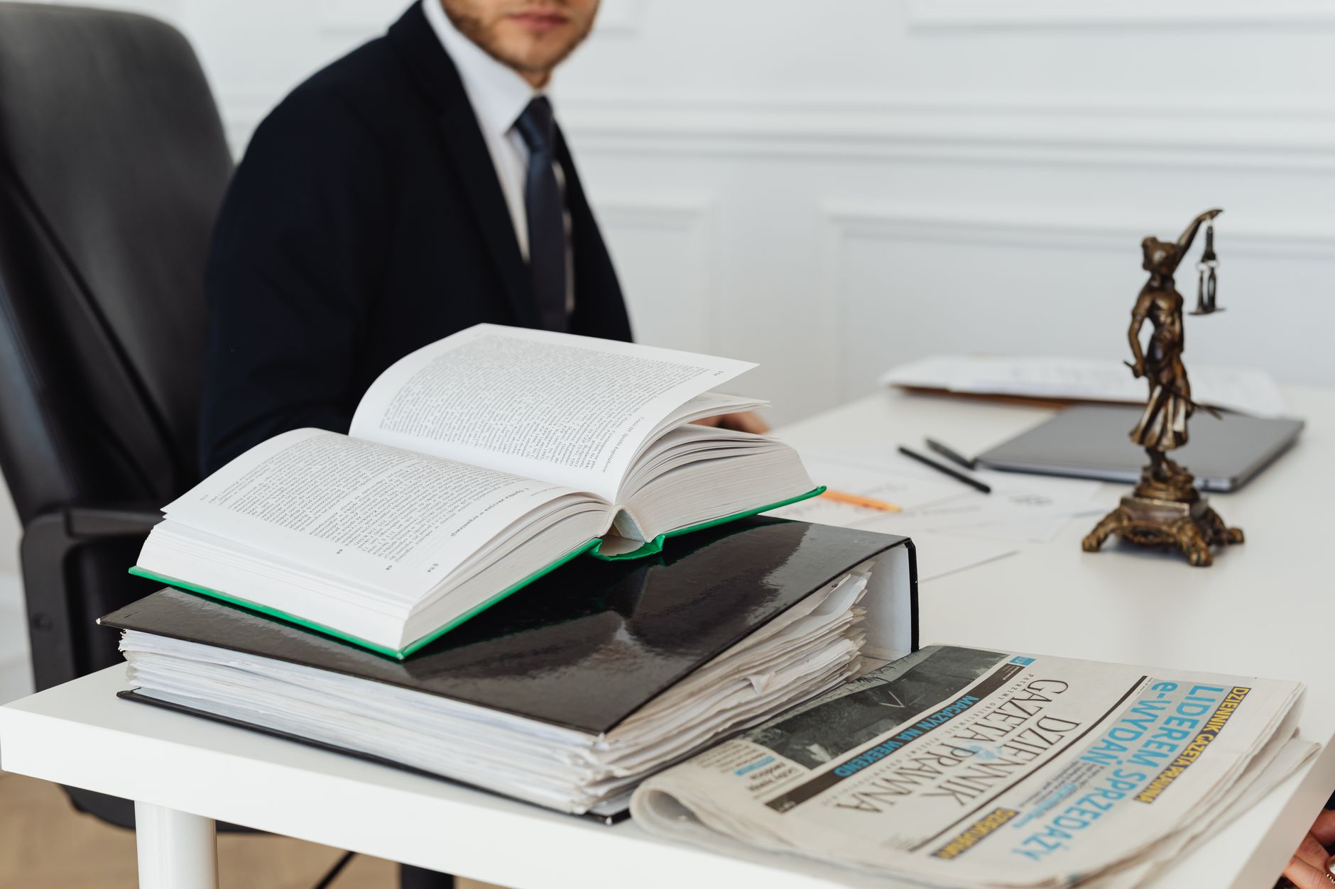 A lawyer at a desk with legal books and documents — the path into remote healthcare law