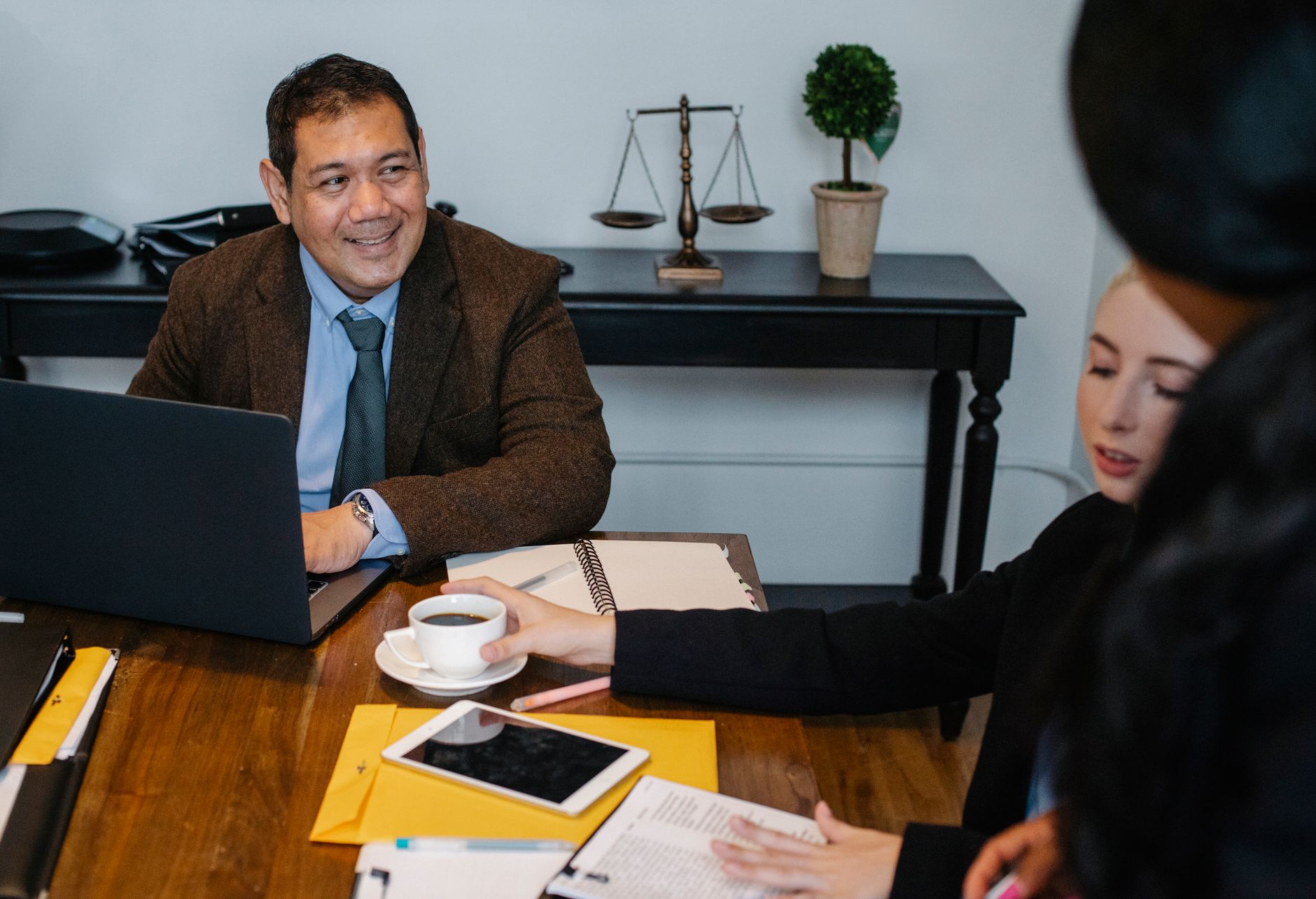 A diverse in-house legal team gathered in a modern office.