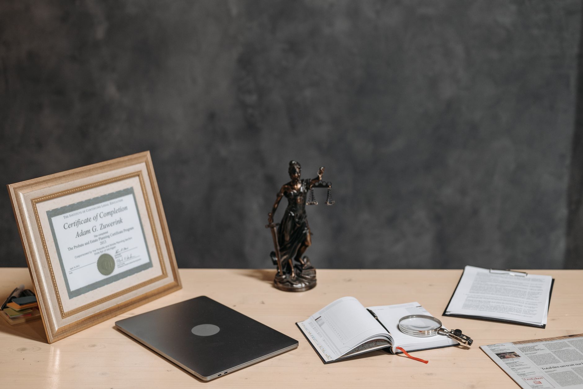 a lawyer reviewing trademark documents at a desk
