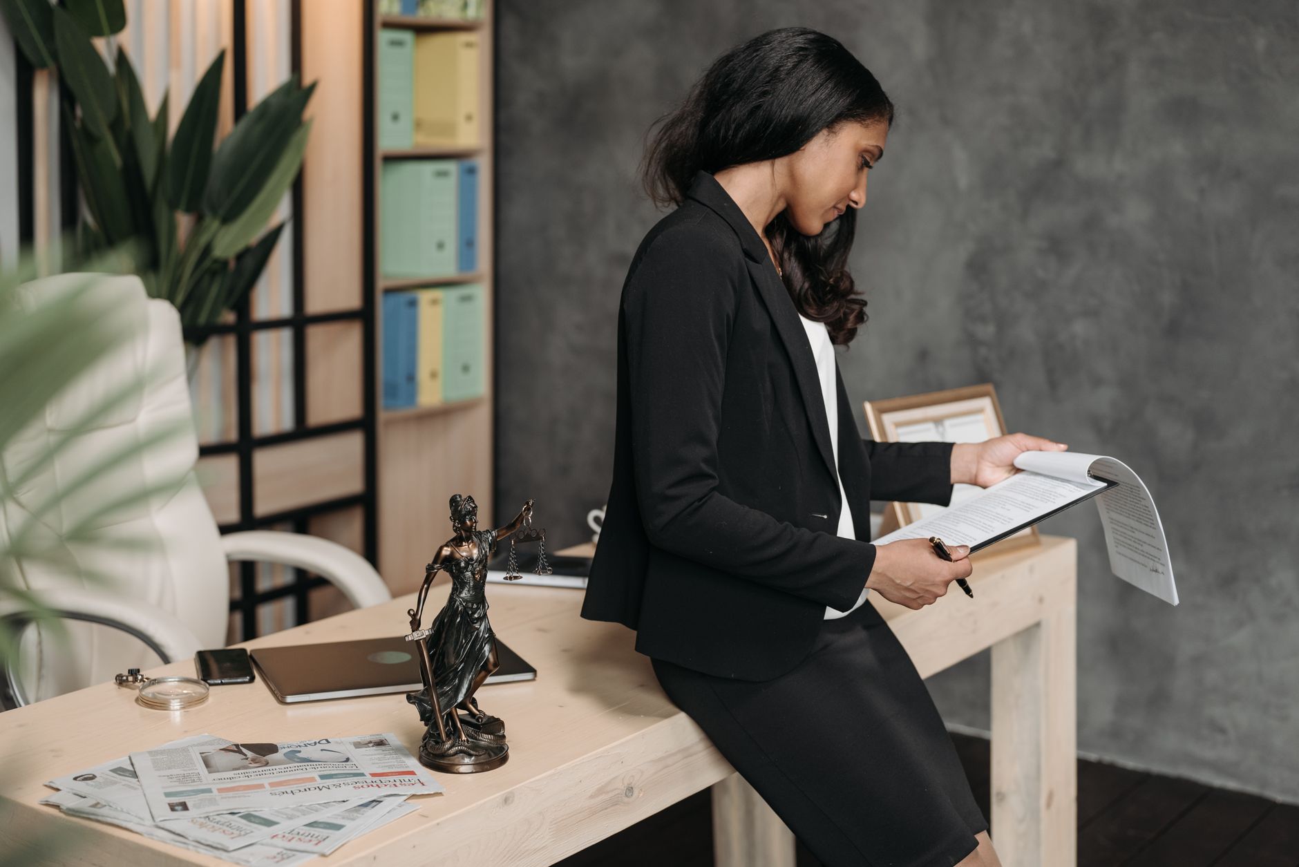 a lawyer reviewing legal documents at an office desk